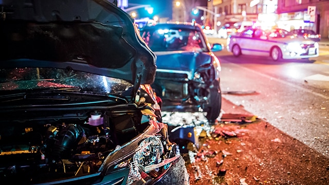 Scene of auto collision at night.